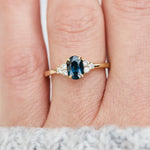 oval teal sapphire yellow gold engagement ring