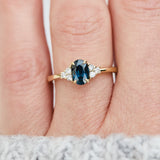 oval teal sapphire yellow gold engagement ring