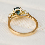 oval unheated green teal sapphire engagement ring in yellow gold
