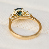oval unheated green teal sapphire engagement ring in yellow gold