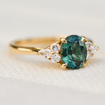 oval unheated green teal sapphire engagement ring in yellow gold