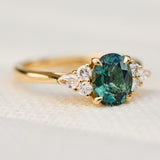 oval unheated green teal sapphire engagement ring in yellow gold