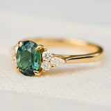 oval unheated green teal sapphire engagement ring in yellow gold