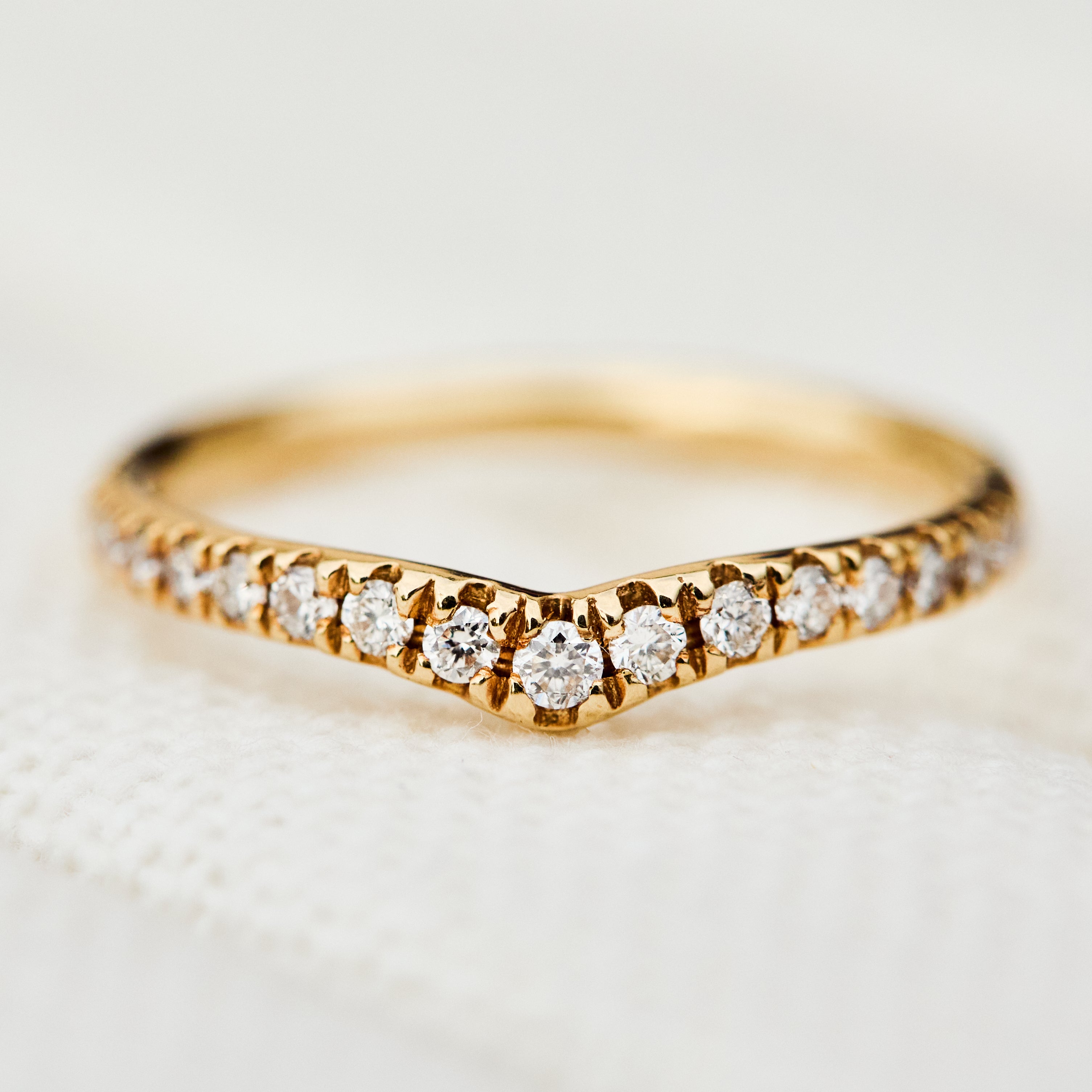pave diamond wedding band in yellow gold
