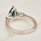 pear shape green teal sapphire trilogy engagement ring in platinum