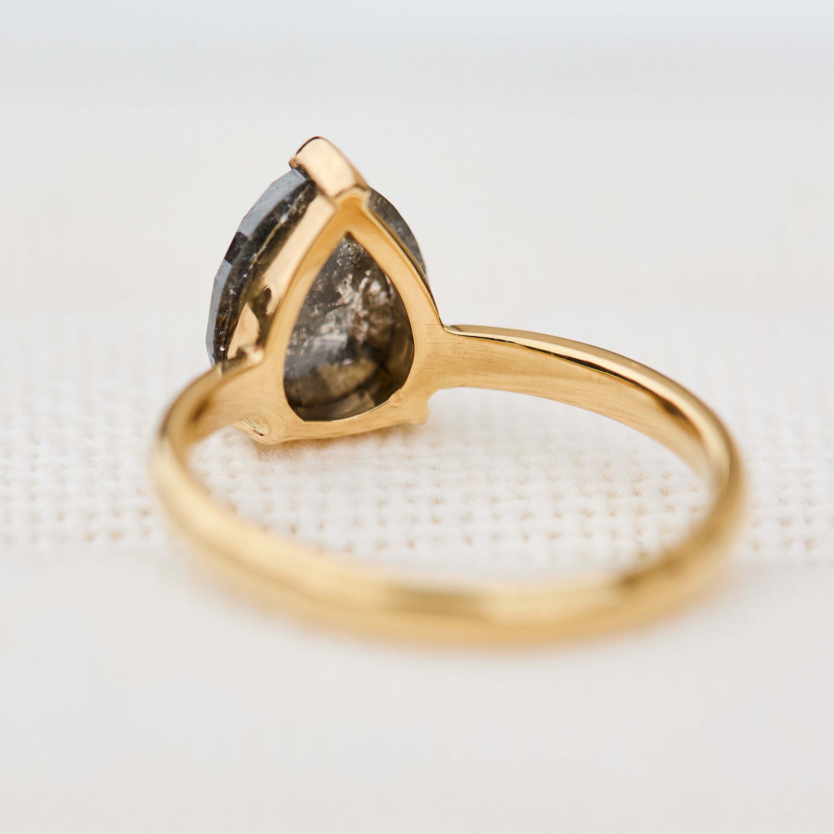 pear shape salt and pepper diamond solitaire ring