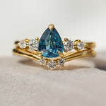 pear shape blue teal sapphire engagement ring stack