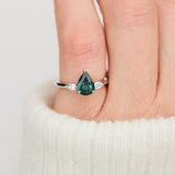 pear shape green teal sapphire trilogy engagement ring in platinum
