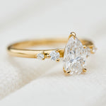 pear shape lab grown diamond engagement ring in yellow gold
