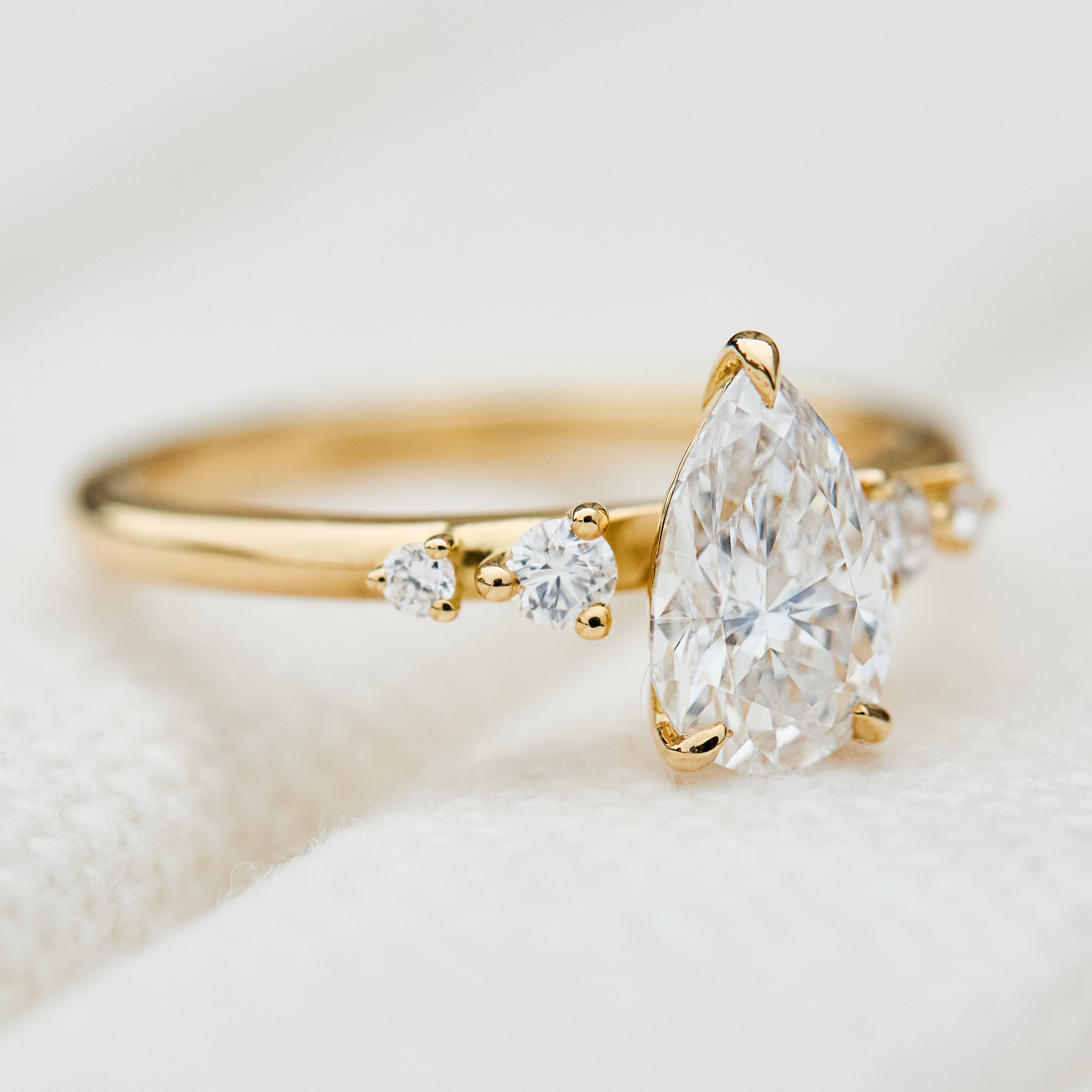 pear shape lab grown diamond engagement ring in yellow gold