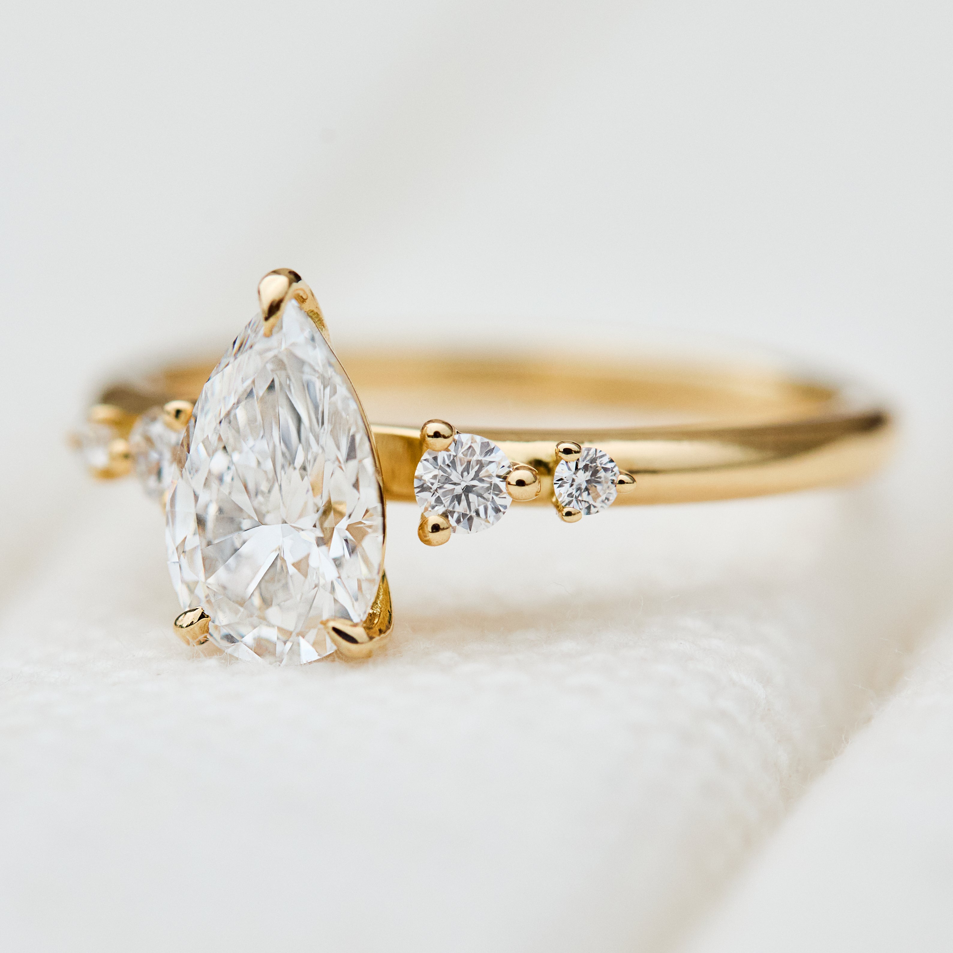 pear shape lab grown diamond engagement ring in yellow gold
