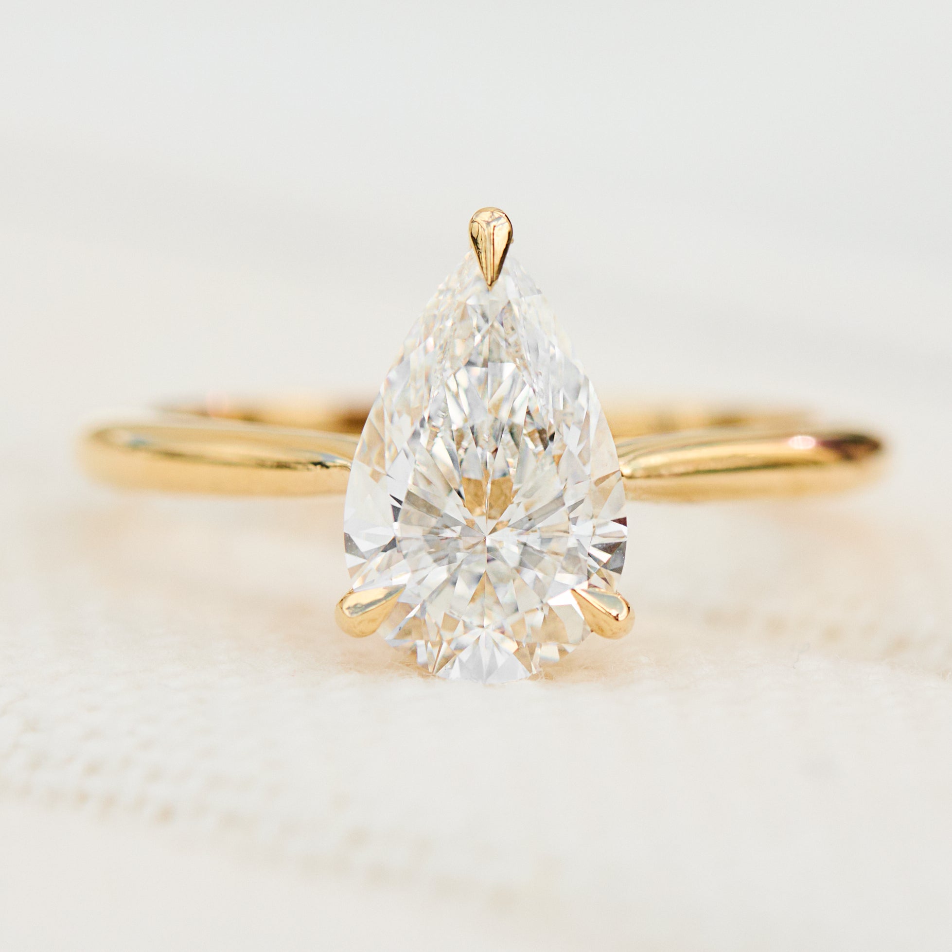 pear shape lab grown diamond yellow gold solitaire engagement ring