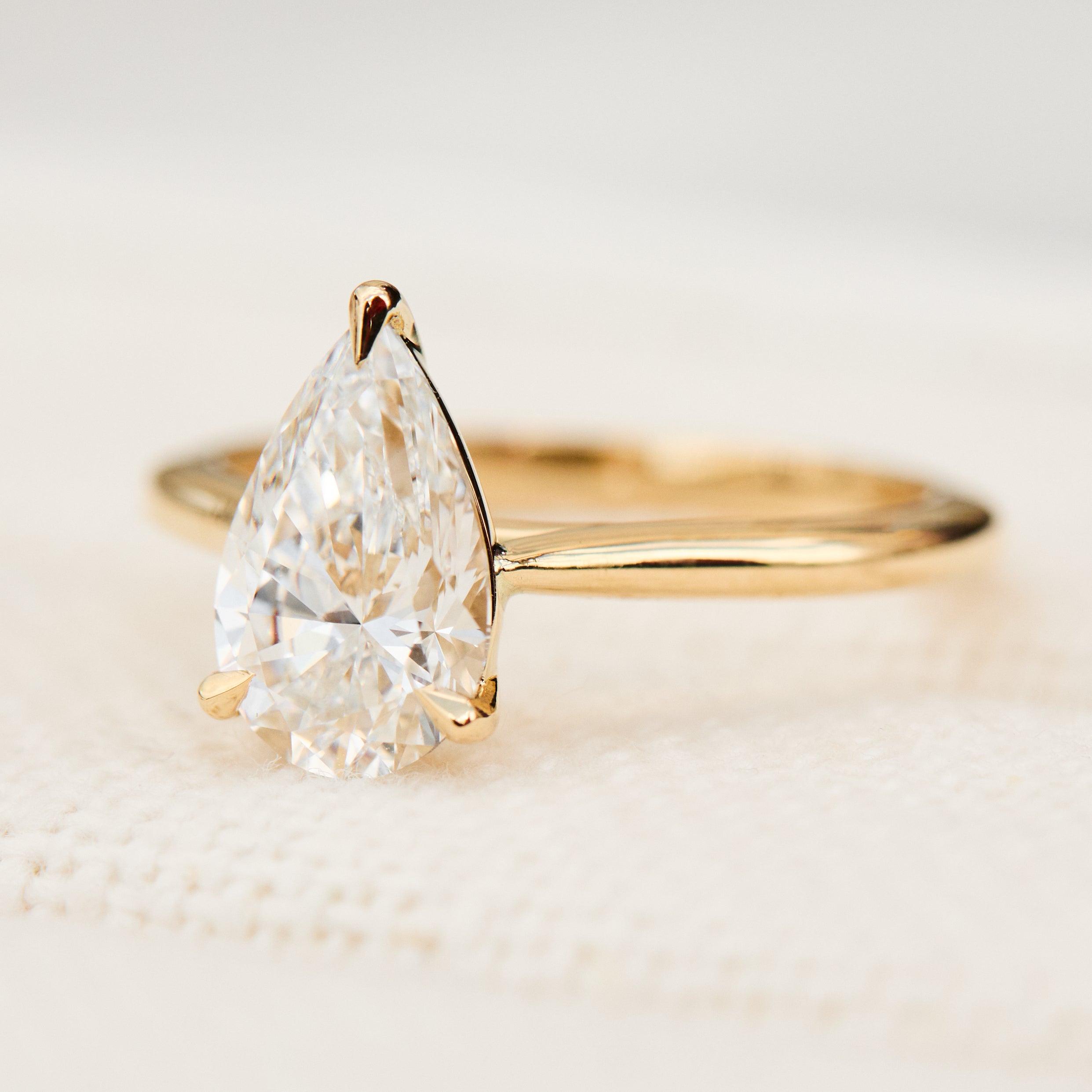 pear shape lab grown diamond yellow gold solitaire engagement ring