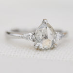 platinum pear shape rose cut salt and pepper diamond trilogy engagement ring