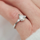platinum pear shape rose cut salt and pepper diamond trilogy engagement ring