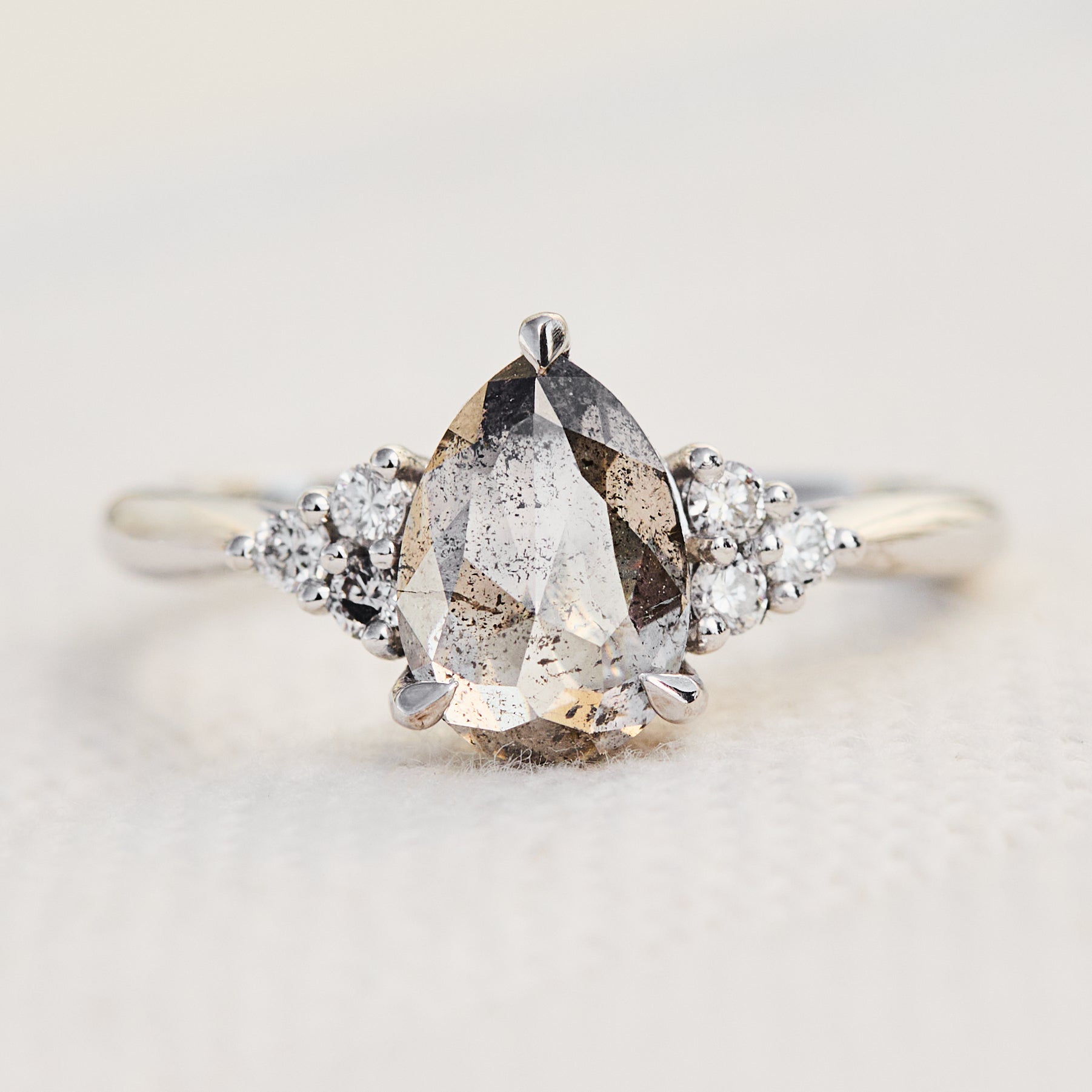 pear shape salt and pepper diamond engagement ring in platinum