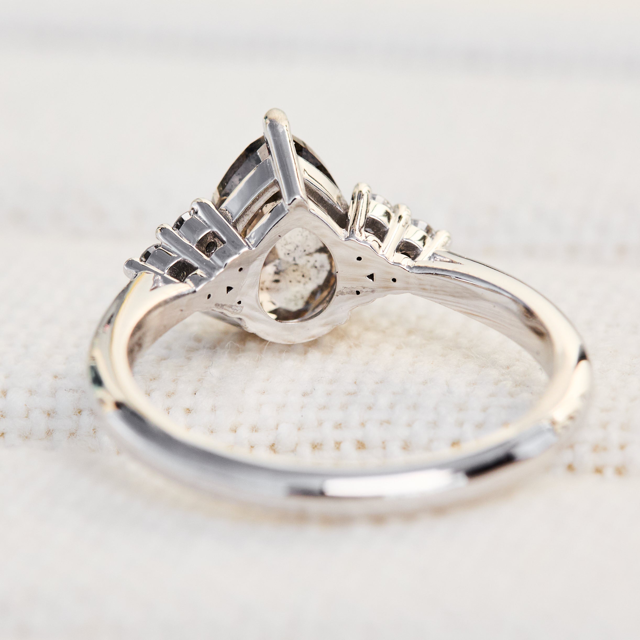 pear shape salt and pepper diamond engagement ring in platinum