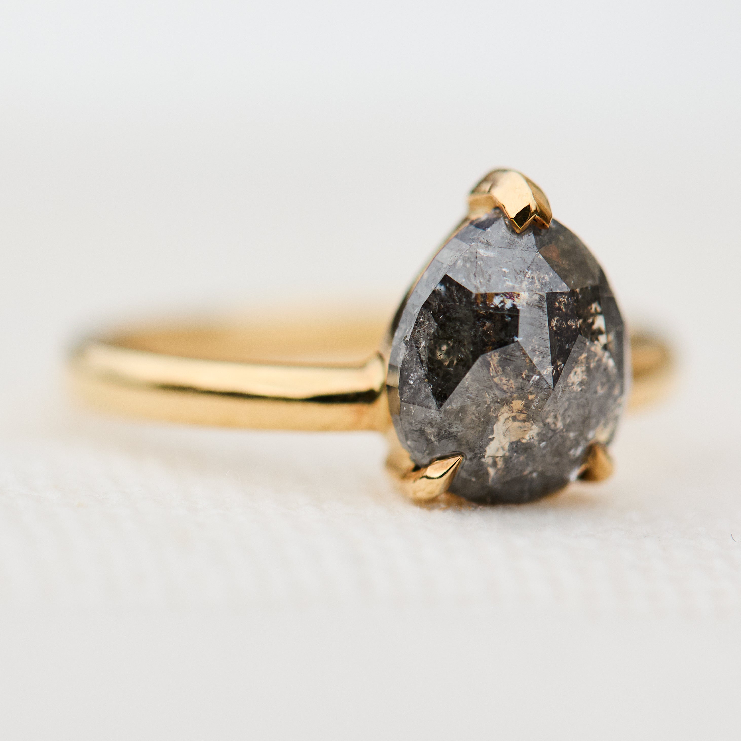 pear shape salt and pepper diamond solitaire ring