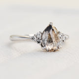 pear shape salt and pepper diamond engagement ring in platinum