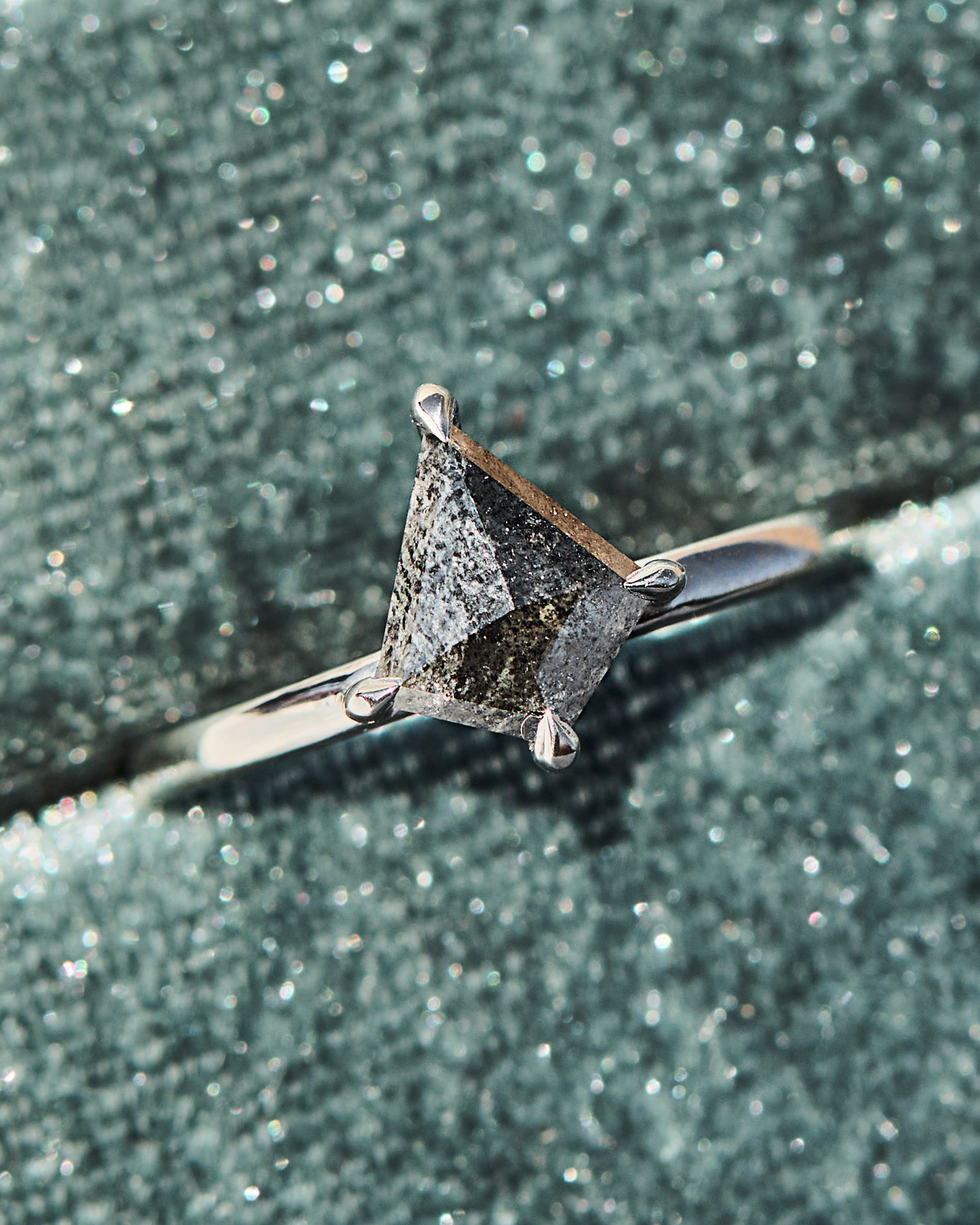 kite shape salt and pepper solitaire engagement ring in platinum