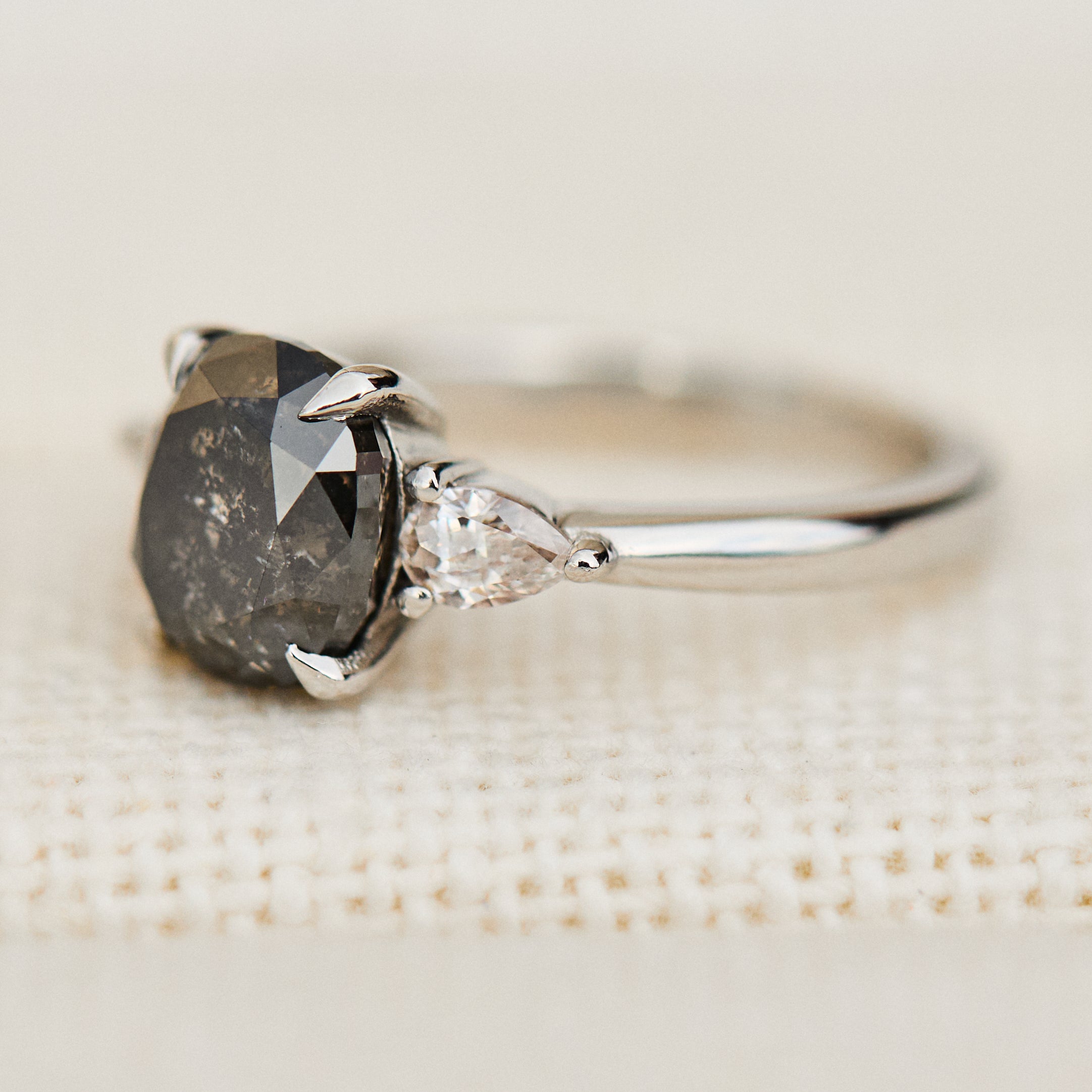 oval salt and pepper diamond trilogy engagement ring