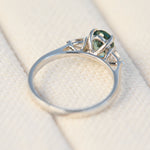 platinum oval teal sapphire engagement trilogy ring