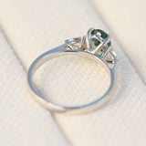 platinum oval teal sapphire engagement trilogy ring