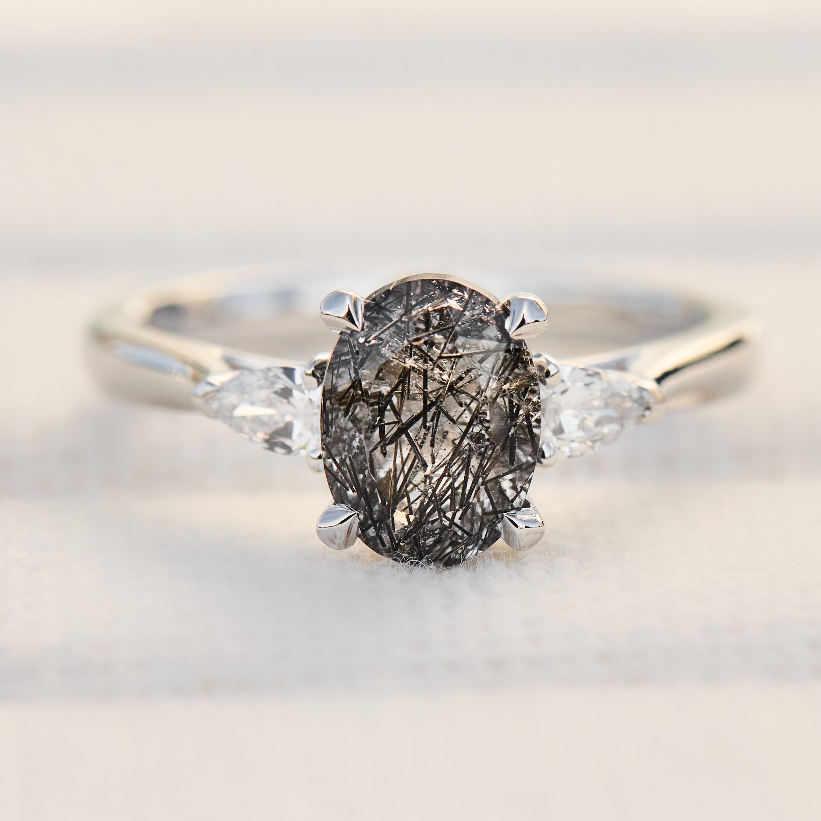 platinum oval tourmilated quartz trilogy engagement ring