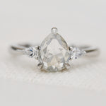 platinum pear shape rose cut salt and pepper diamond trilogy engagement ring