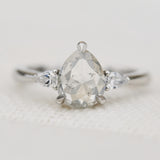 platinum pear shape rose cut salt and pepper diamond trilogy engagement ring