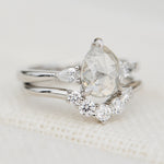 platinum pear shape rose cut salt and pepper diamond trilogy engagement ring