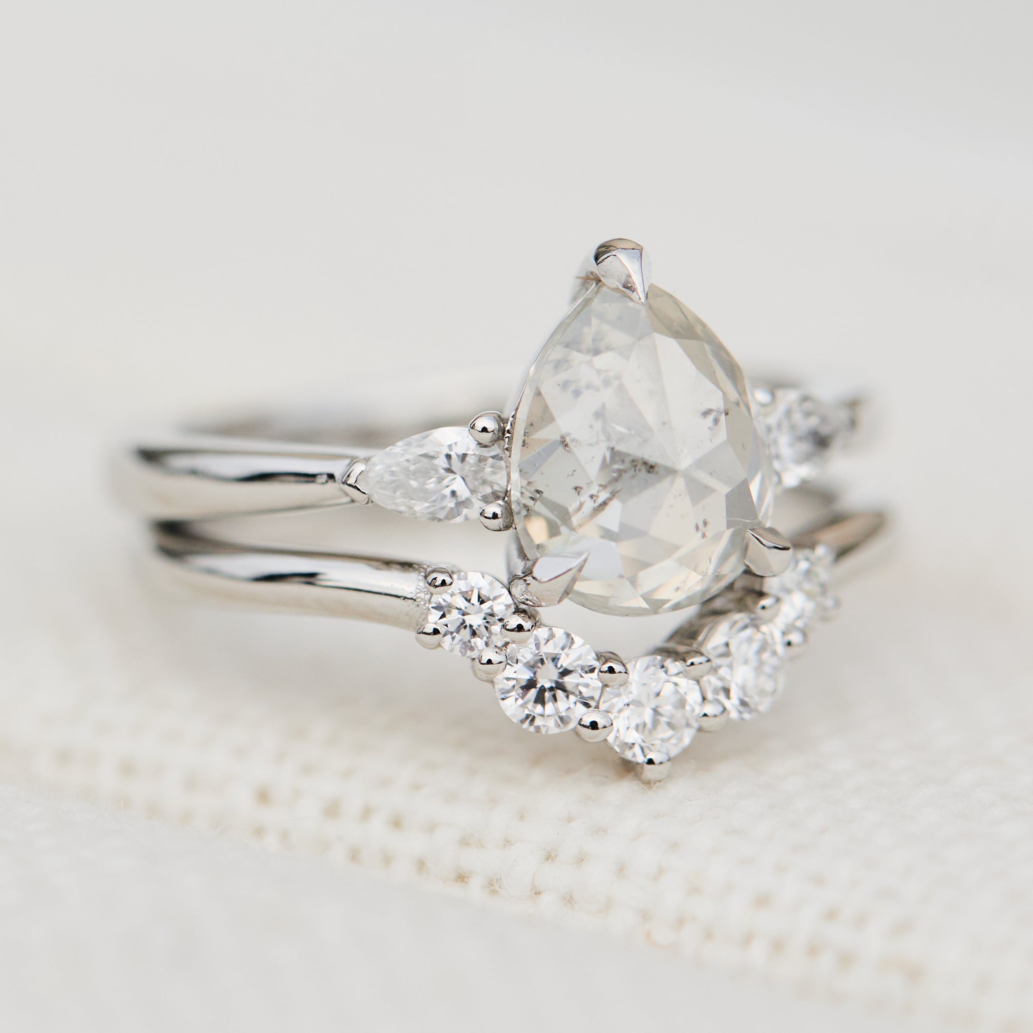 platinum pear shape rose cut salt and pepper diamond trilogy engagement ring