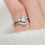 platinum pear shape rose cut salt and pepper diamond trilogy engagement ring