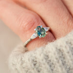 platinum oval teal sapphire engagement trilogy ring