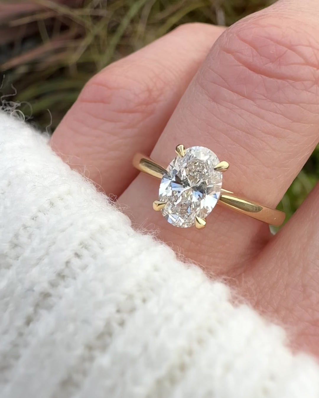 oval lab grown diamond engagement ring in yellow gold