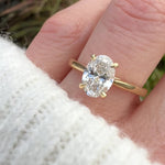 oval lab grown diamond engagement ring in yellow gold
