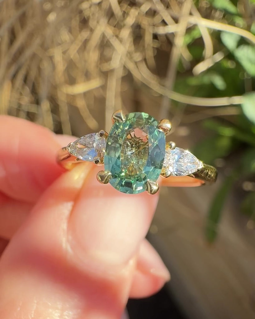 oval green sapphire engagement ring yellow gold