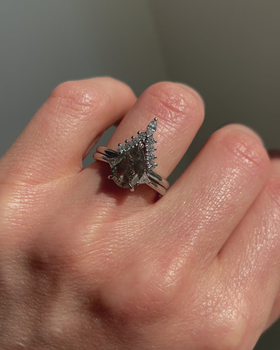Platinum salt and pepper pear diamond engagement trilogy ring
