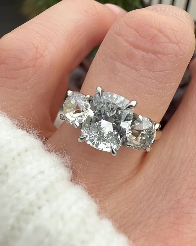 elongated cushion lab grown diamond trilogy engagement ring in yellow gold