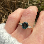 oval australian teal sapphire trilogy engagement ring in yellow gold