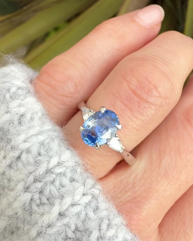 oval sri lankan blue sapphire trilogy platinum engagement ring