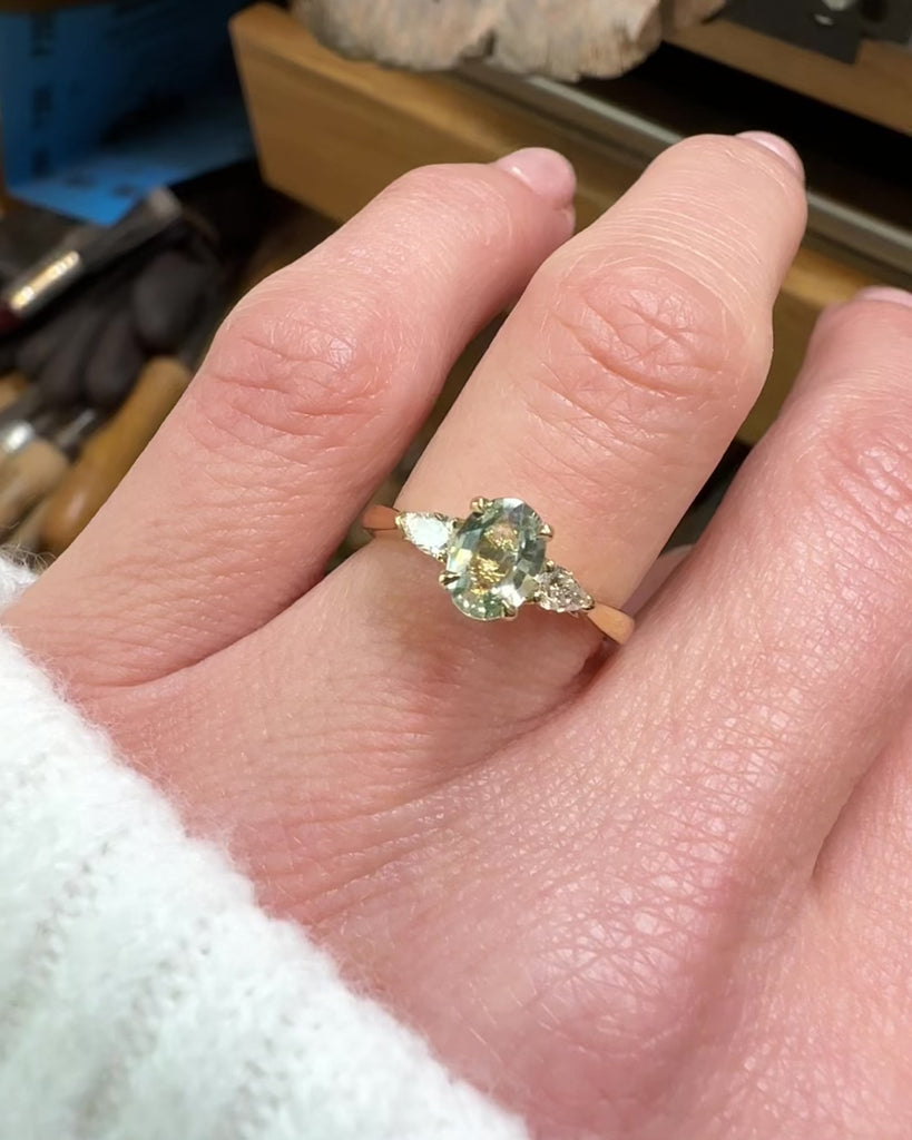 montana oval sapphire trilogy yellow gold engagement ring