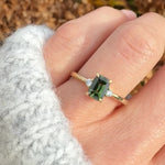 emerald cut green sapphire ring in yellow gold