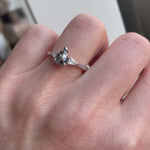 Platinum salt and pepper pear diamond engagement trilogy ring