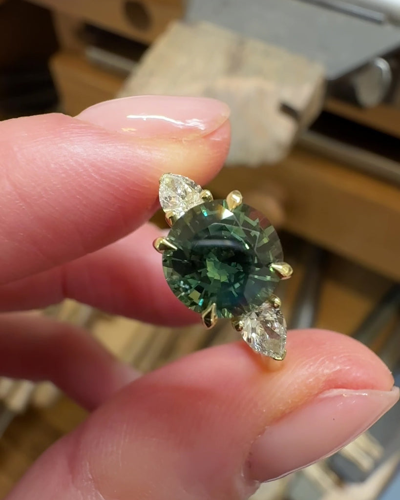 round brilliant cut madagascan teal sapphire trilogy engagement ring