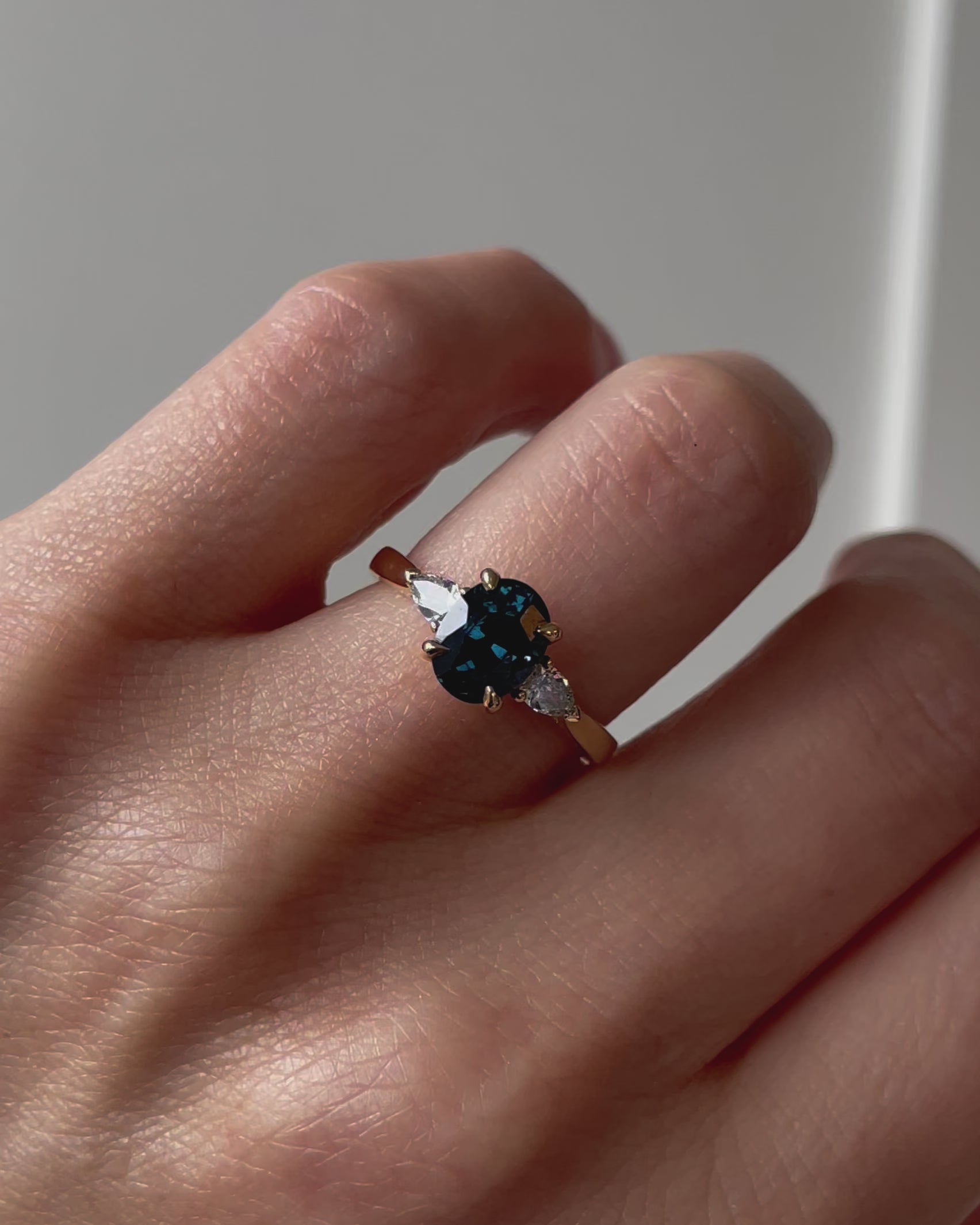 18ct yellow gold oval trilogy ​teal sapphire rings