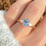 blue sapphire yellow gold trilogy engagement ring