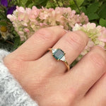 18ct yellow gold emerald cut trilogy ​teal sapphire rings