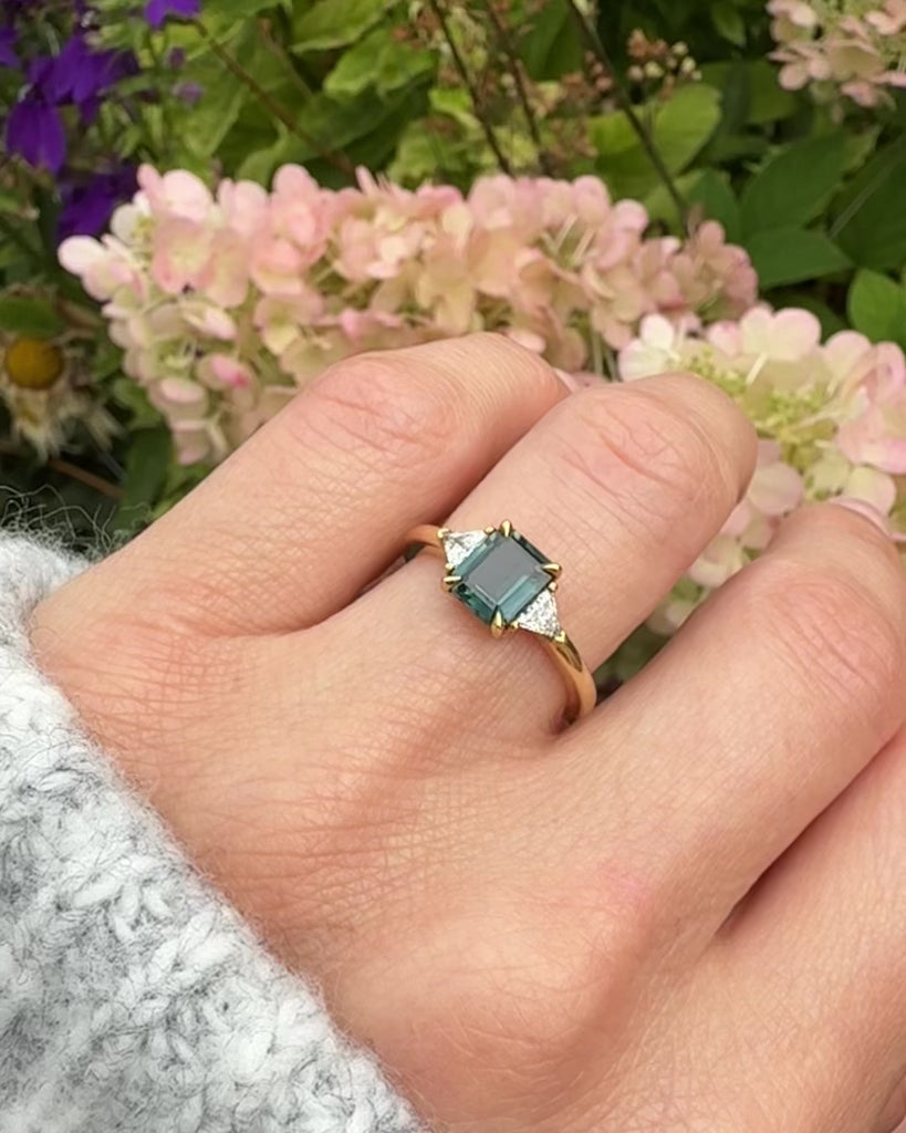 18ct yellow gold emerald cut trilogy ​teal sapphire rings