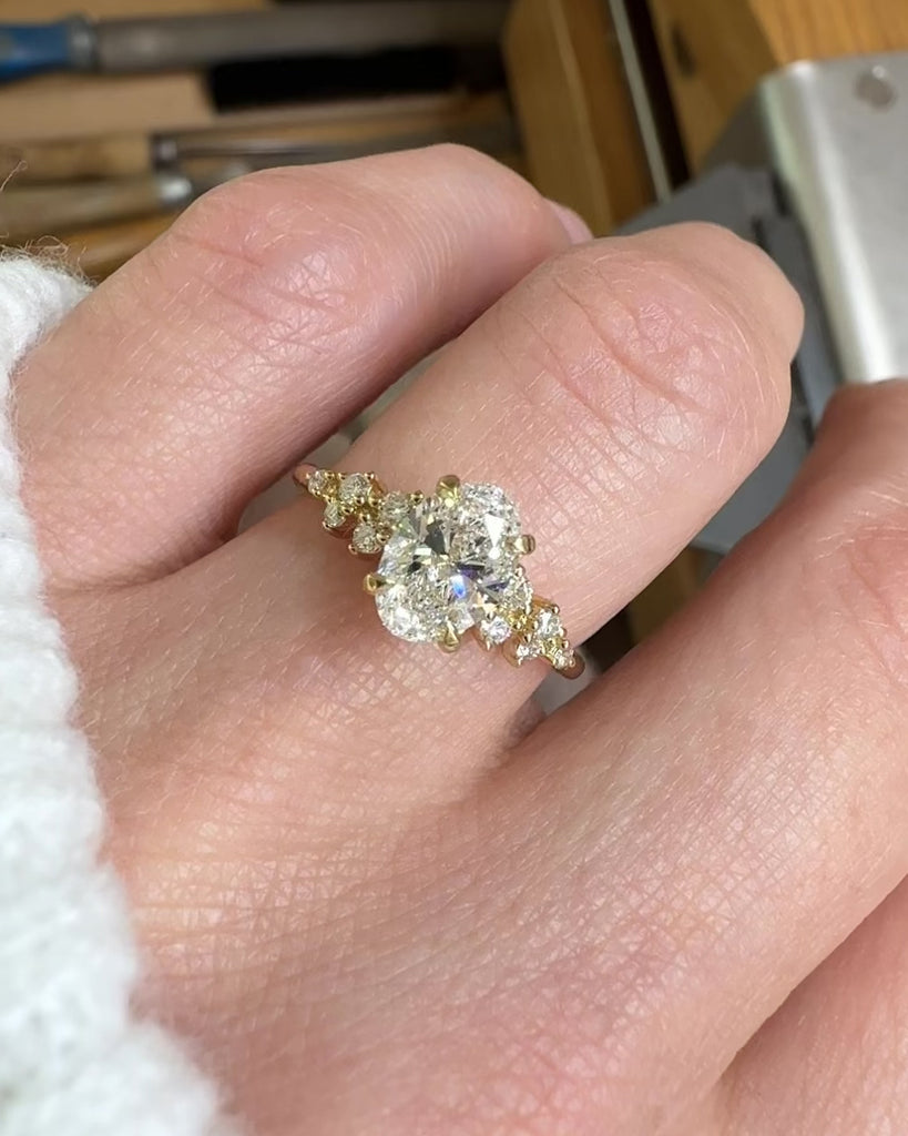 oval lab grown diamond engagement ring set in timeless yellow gold